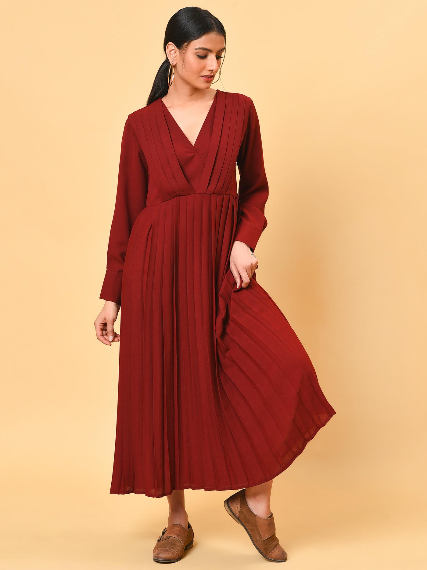 Ultra chic in the maroon pleated long dress