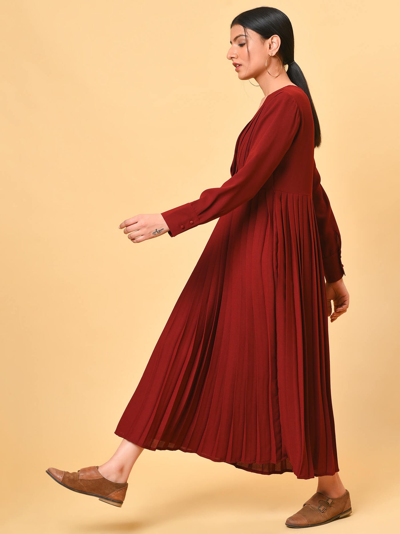 Ultra chic in the maroon pleated long dress