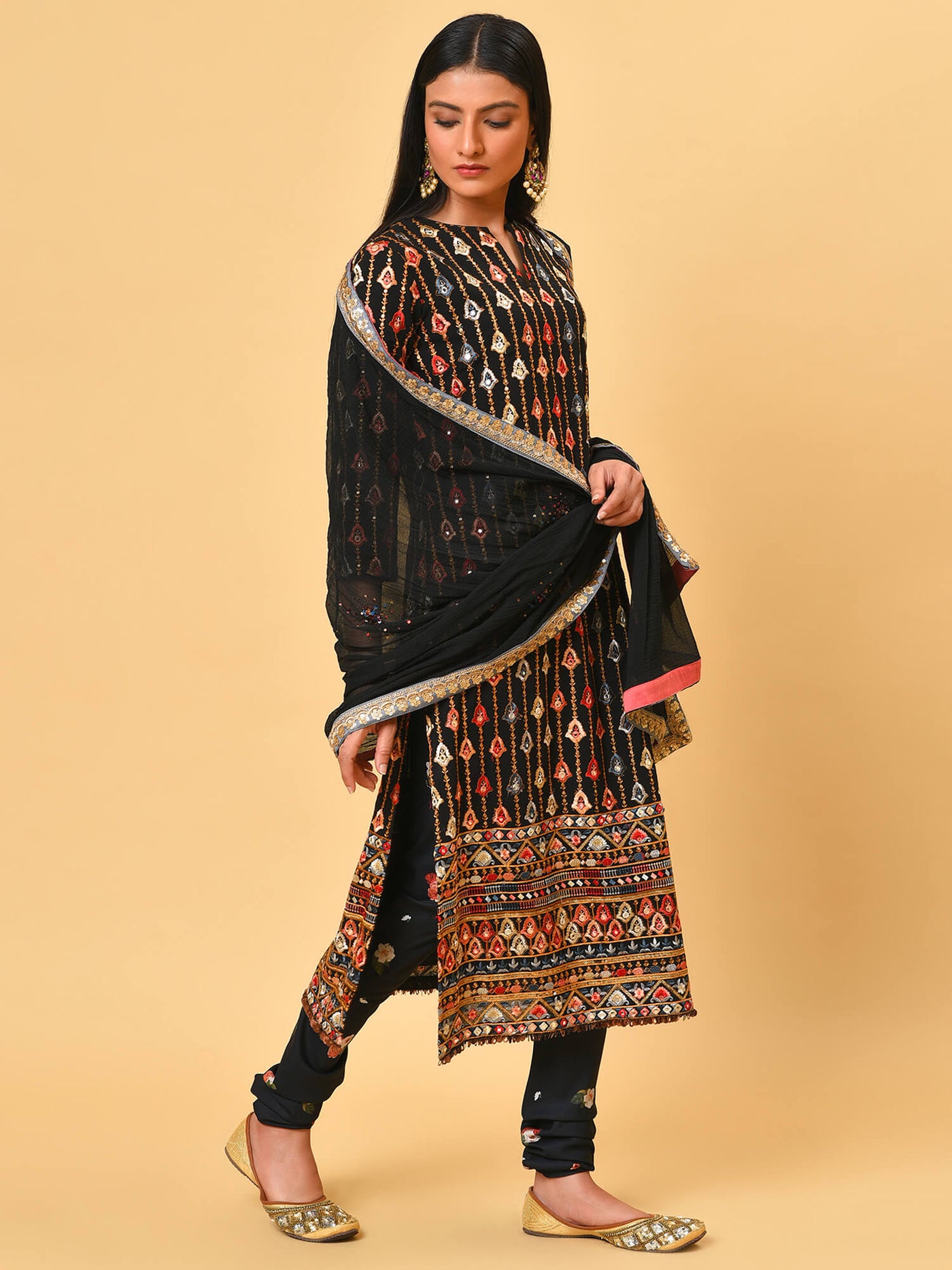 Classy in this black kurta, churidar and dupatta