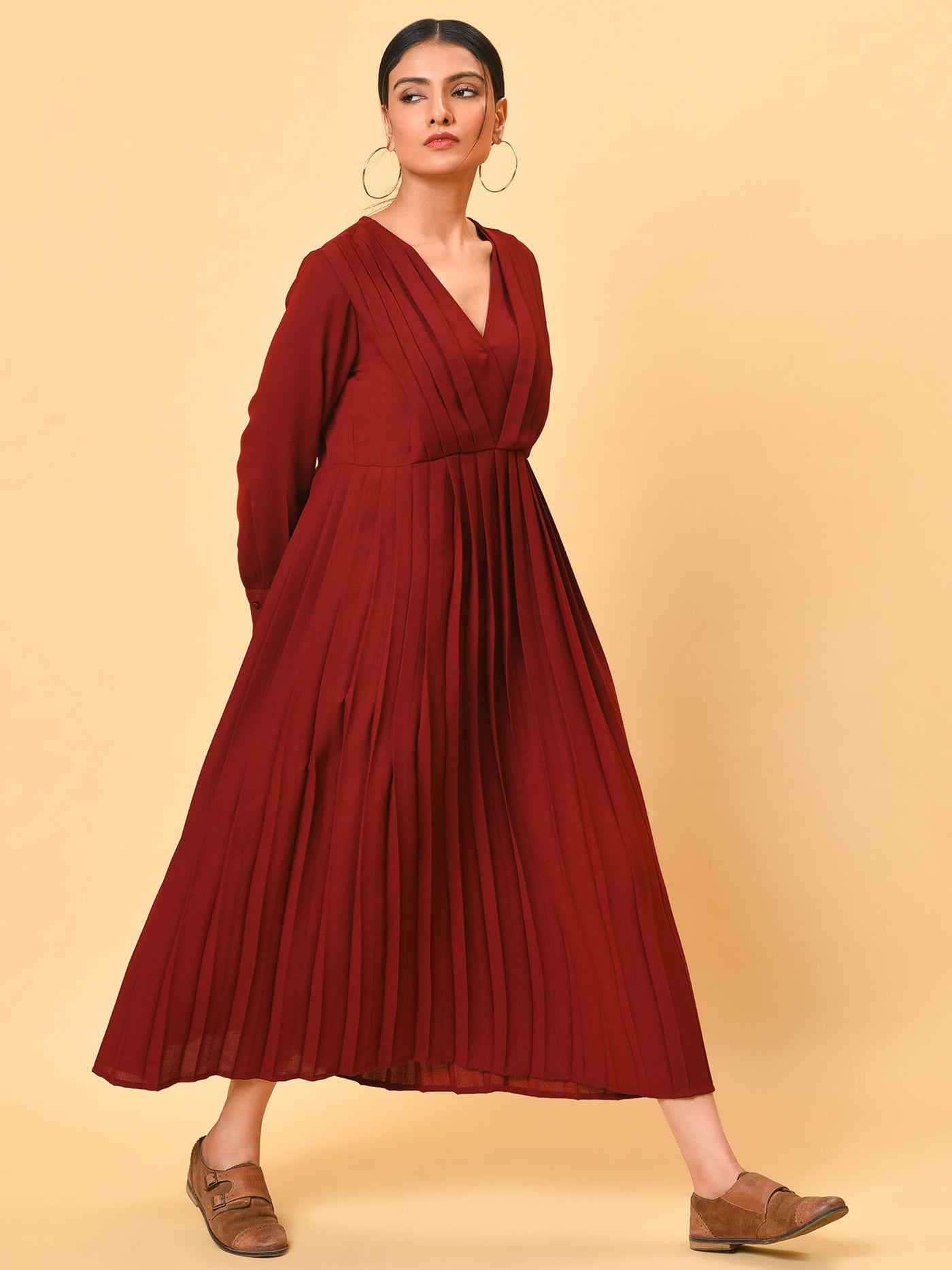 Ultra chic in the maroon pleated long dress