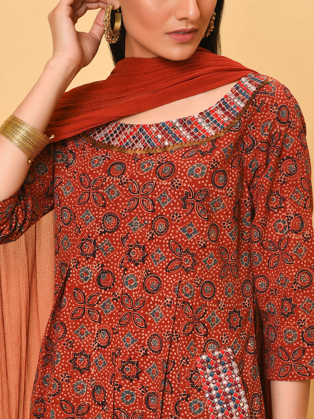 Indian apple cinnamon summer in a maroon ikat kurta pant and dupatta