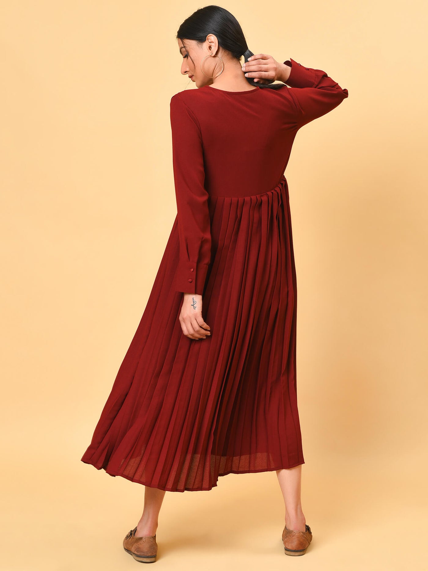 Ultra chic in the maroon pleated long dress