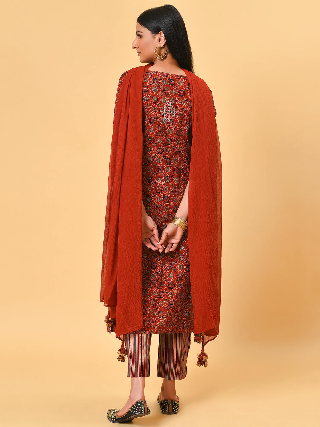 Indian apple cinnamon summer in a maroon ikat kurta pant and dupatta