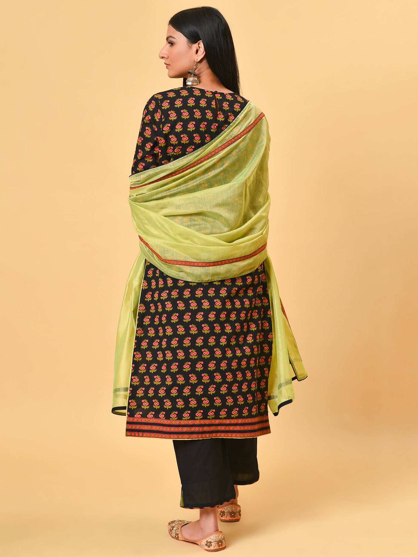 A Cherry black printed kurta with a black pant and Lime green chanderi dupatta
